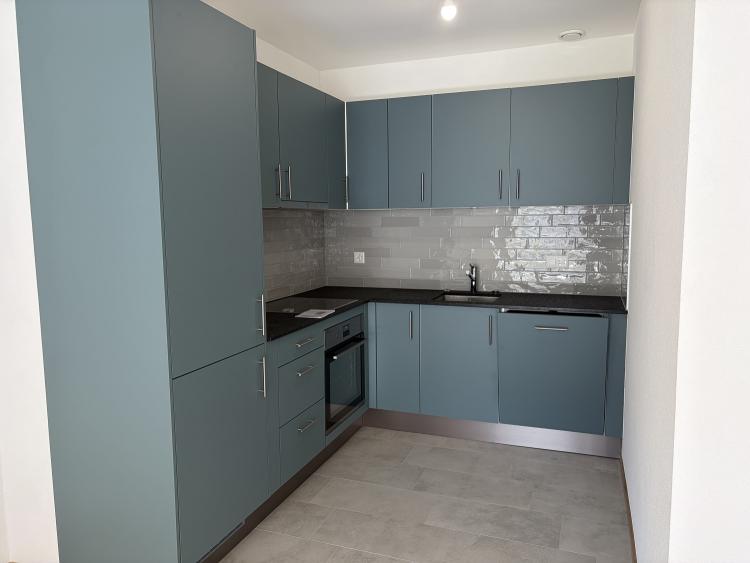 Magnifique appartement de 2.5 pièces au 1er étage d'un immeuble neuf avec balcon